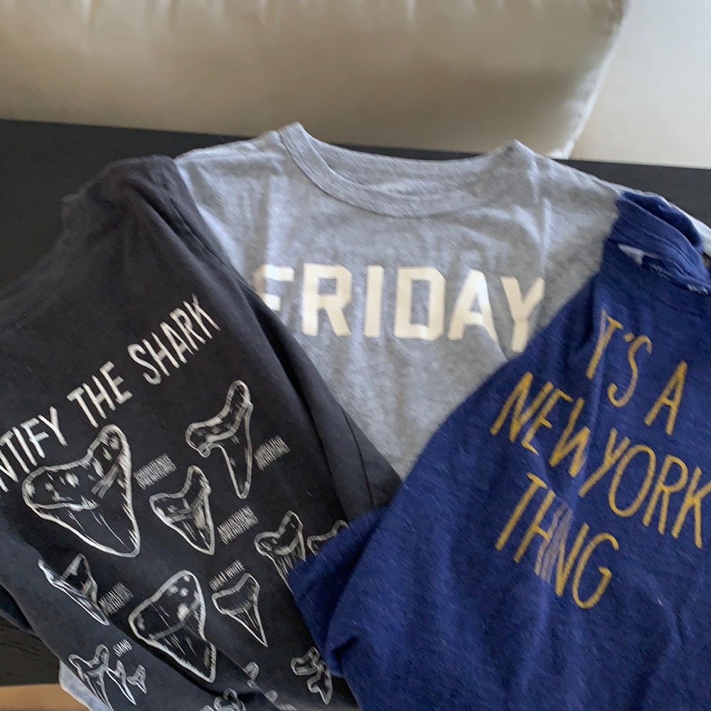 Four t-shirts.One long sleeve with hood. Three short sleeve. One vineyard vine.